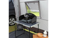 Outdoor Revolution Outhouse Handi Mid Driveaway Awning interior shown with example kitchen, window has half mesh vent with external curtain